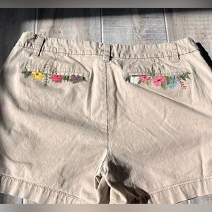 Repurposed Khaki shorts with hand painted flowers on back pockets.